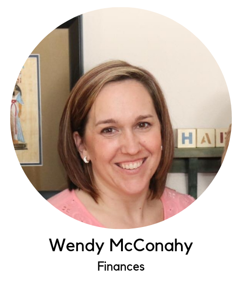Wendy McConahy, finances. White woman with brown hair wearing a pink t-shirt.